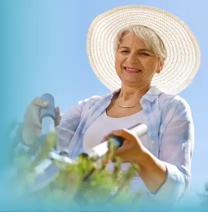 Smiling senior woman gardening